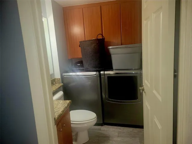 a bathroom with a toilet and a sink
