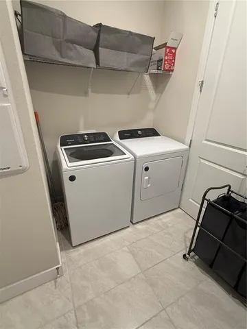 a view of two chairs in the patio