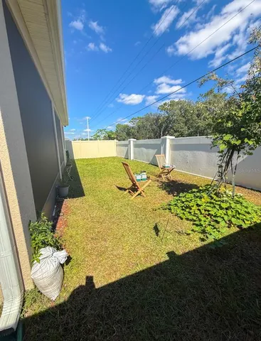 a view of a patio with swimming pool table and chairs
