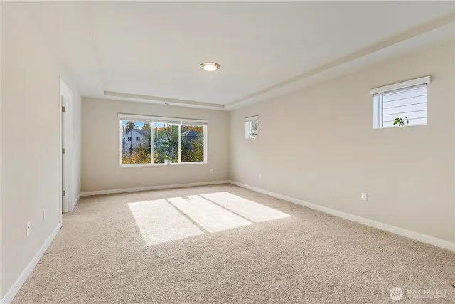 a bathroom with a double vanity sink a mirror and a bathtub