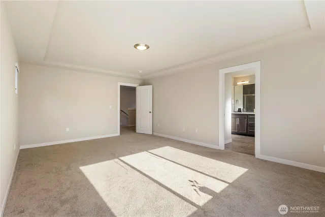 a bathroom with a shower and a glass door
