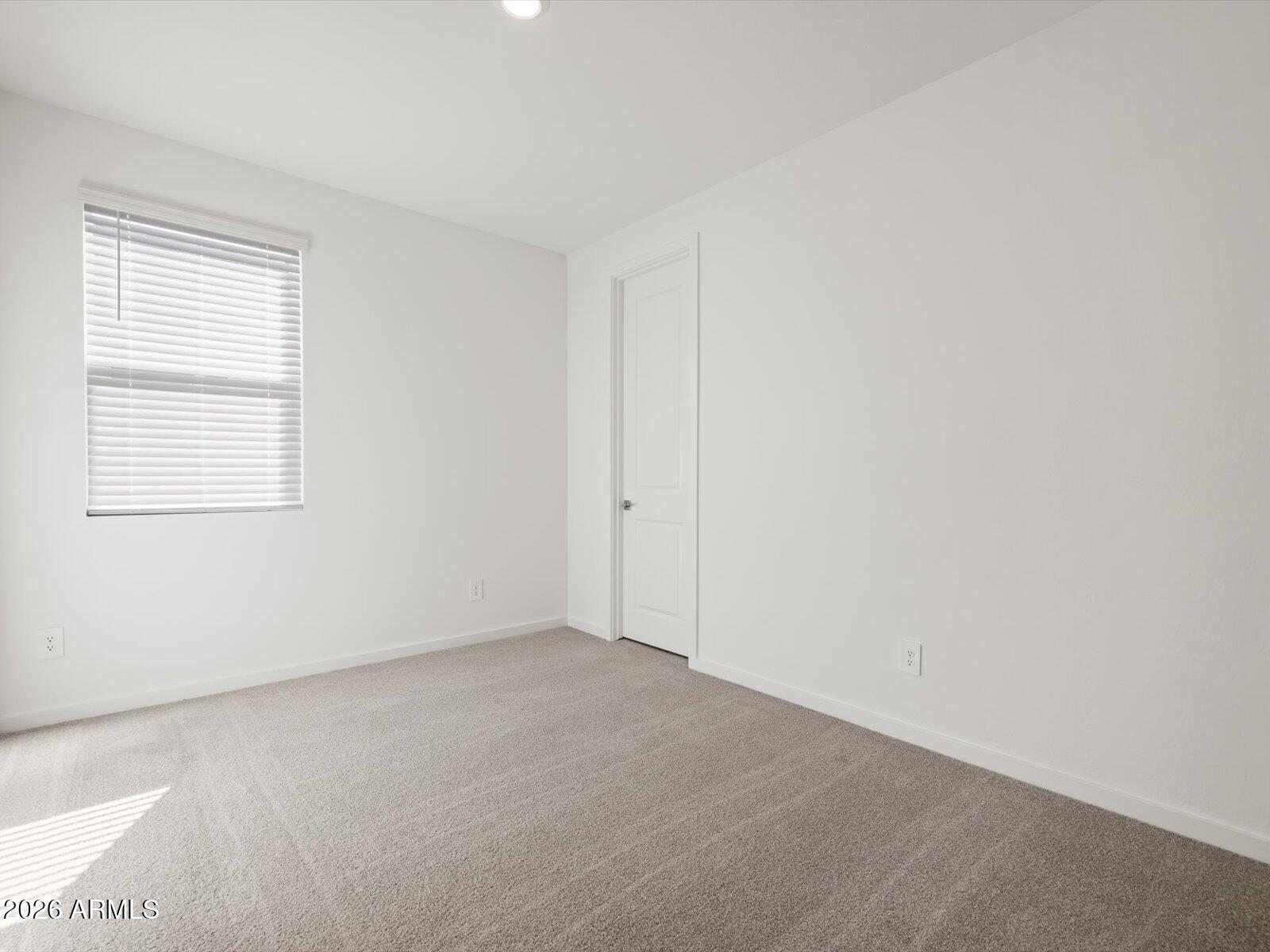 2380 Grenache Road San Tan Valley, AZ 85143 - Photo 3 of 78 an empty room with a window