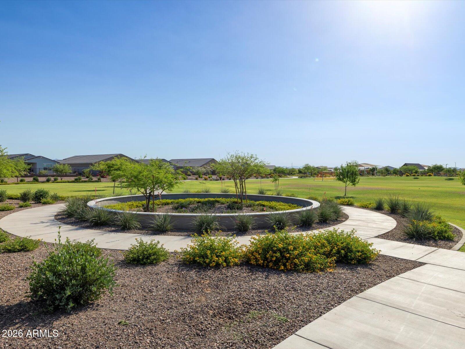 2380 Grenache Road San Tan Valley, AZ 85143 - Photo 48 of 78 a view of a lake with houses in the back