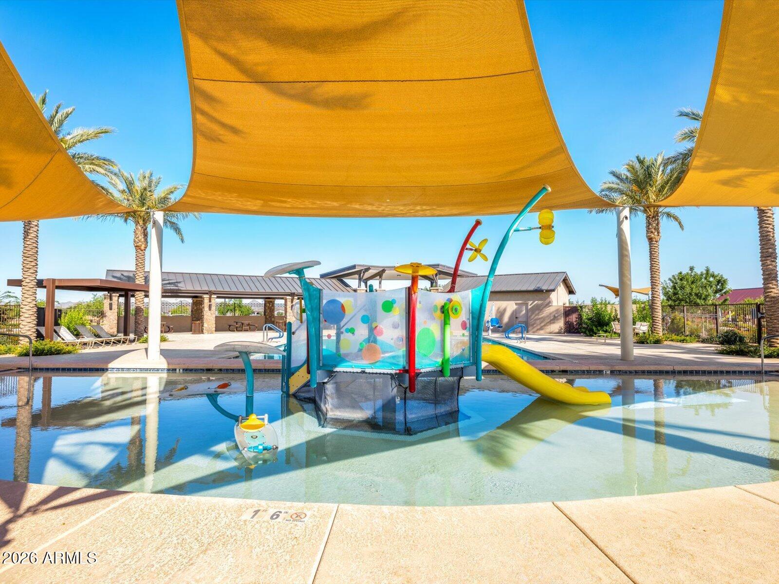 2380 Grenache Road San Tan Valley, AZ 85143 - Photo 57 of 78 a view of a swimming pool with a bench and fire pit