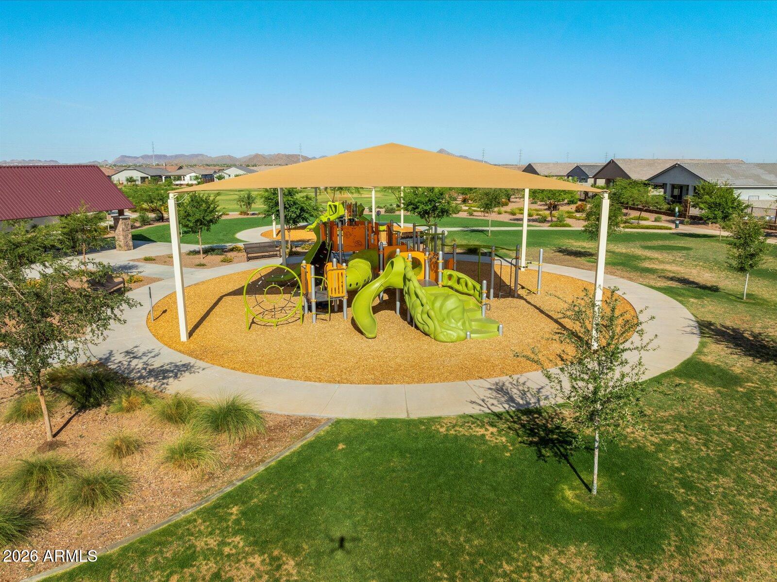 2380 Grenache Road San Tan Valley, AZ 85143 - Photo 77 of 78 a view of a swimming pool with a patio and a yard
