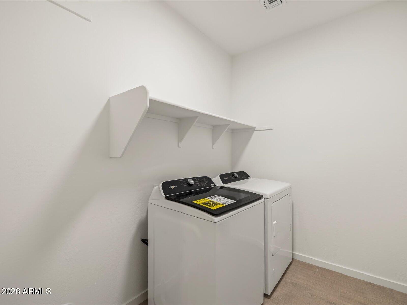 2380 Grenache Road San Tan Valley, AZ 85143 - Photo 9 of 78 a utility room with dryer and washer