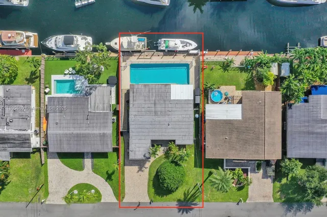 an aerial view of a house with a garden and balcony