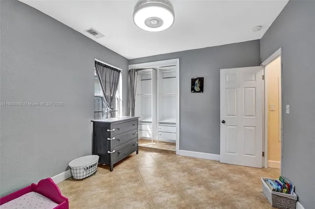 a view of livingroom with furniture and closet