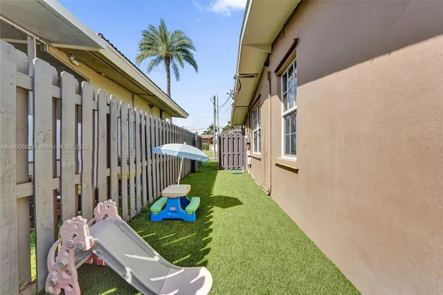 a view of yard from a corridor