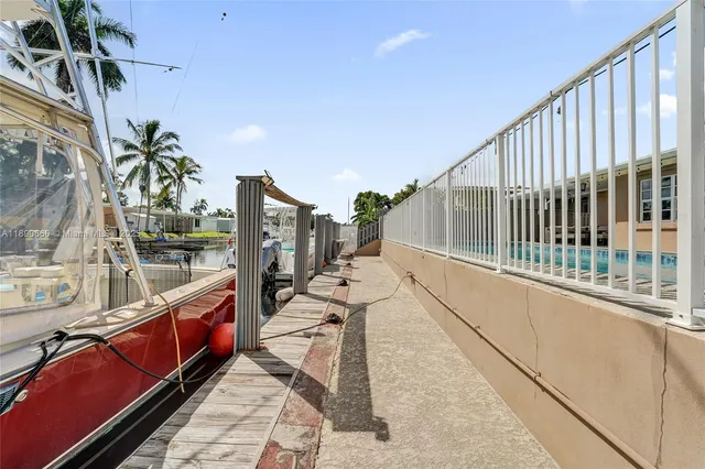 a view of a balcony with chairs