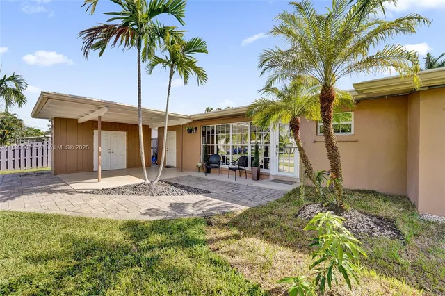 a view of a backyard with a patio