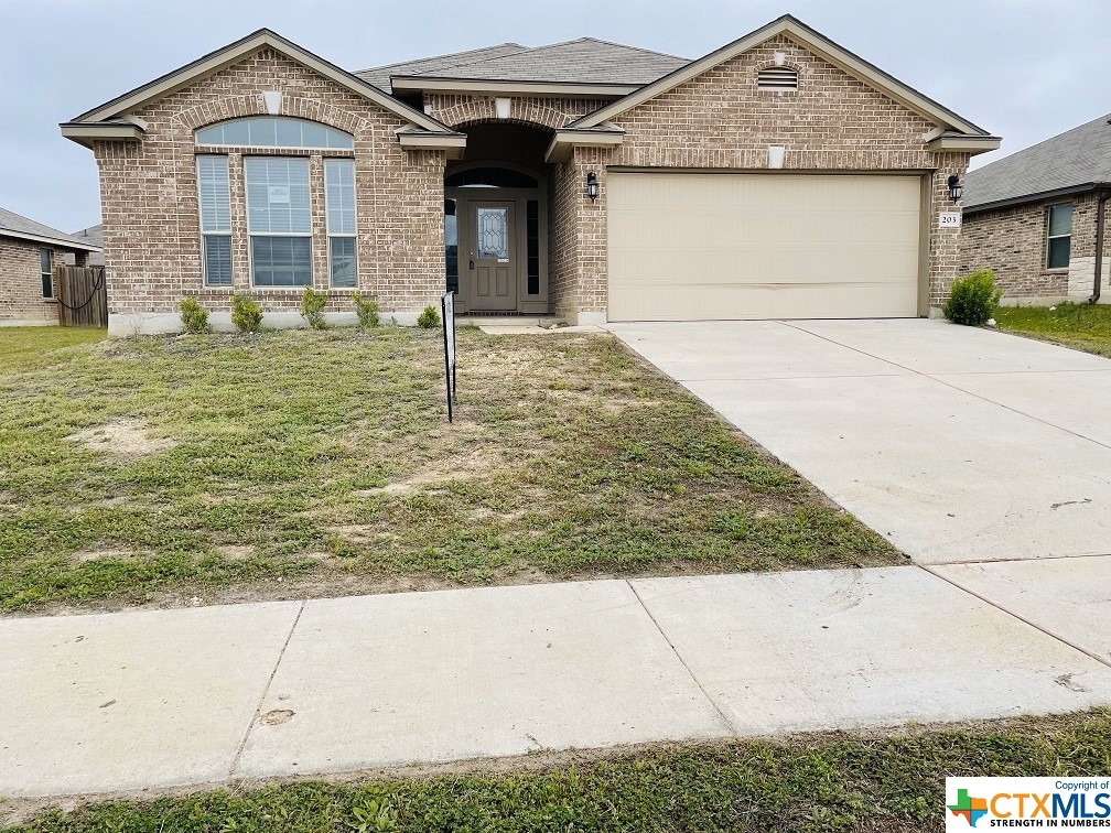 203 Ken Drive Killeen, TX 76542 - Photo 1 of 1 a front view of a house with garden