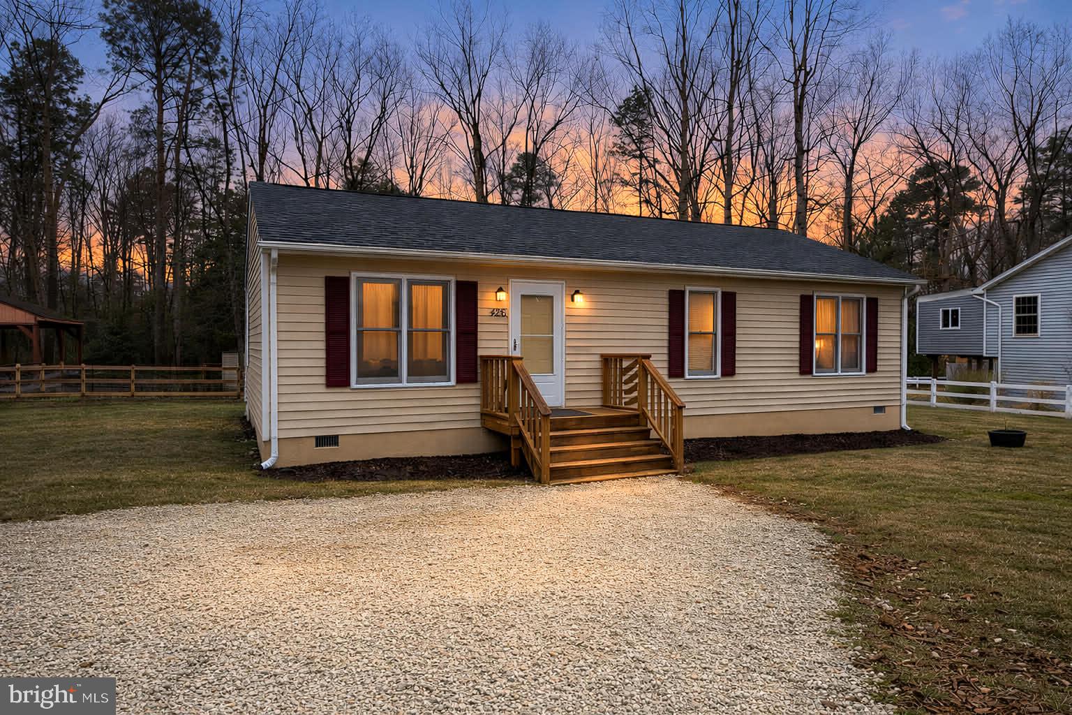 a view of a house with a back yard