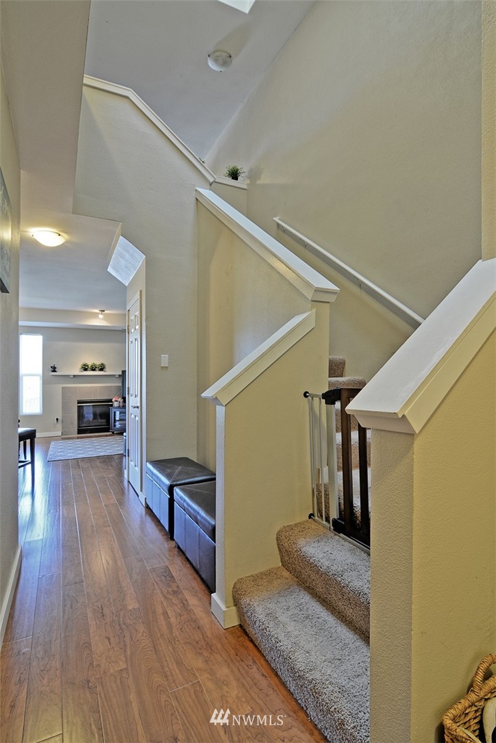 18930 Bothell Everett Highway, Unit M105 Bothell, WA 98012 - Photo 8 of 19 a view of a hallway view with staircase