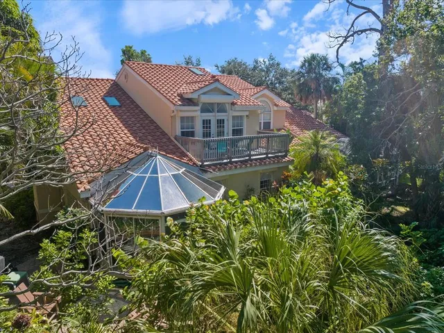 a living room with furniture fireplace and a large window