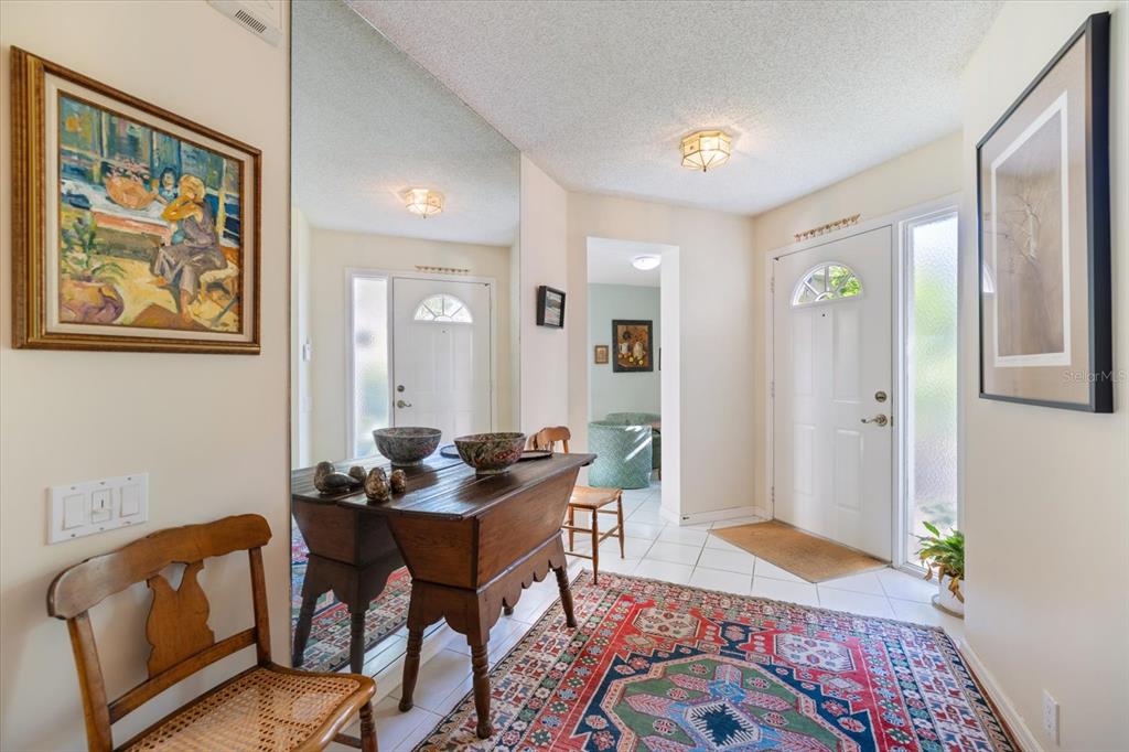 447 Oak Point Road Osprey, FL 34229 - Photo 18 of 99 a living room with furniture and a rug