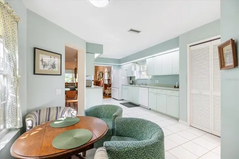 a bathroom with a glass shower door and a shower