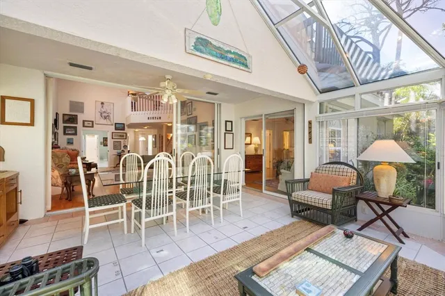 a view of a patio with table and chairs and potted plants