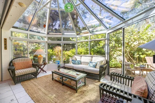 a view of a house with a yard and sitting area
