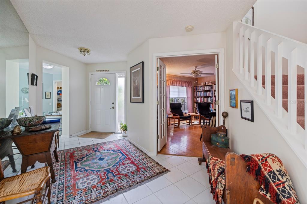 447 Oak Point Road Osprey, FL 34229 - Photo 43 of 99 a living room with furniture and a wooden floor