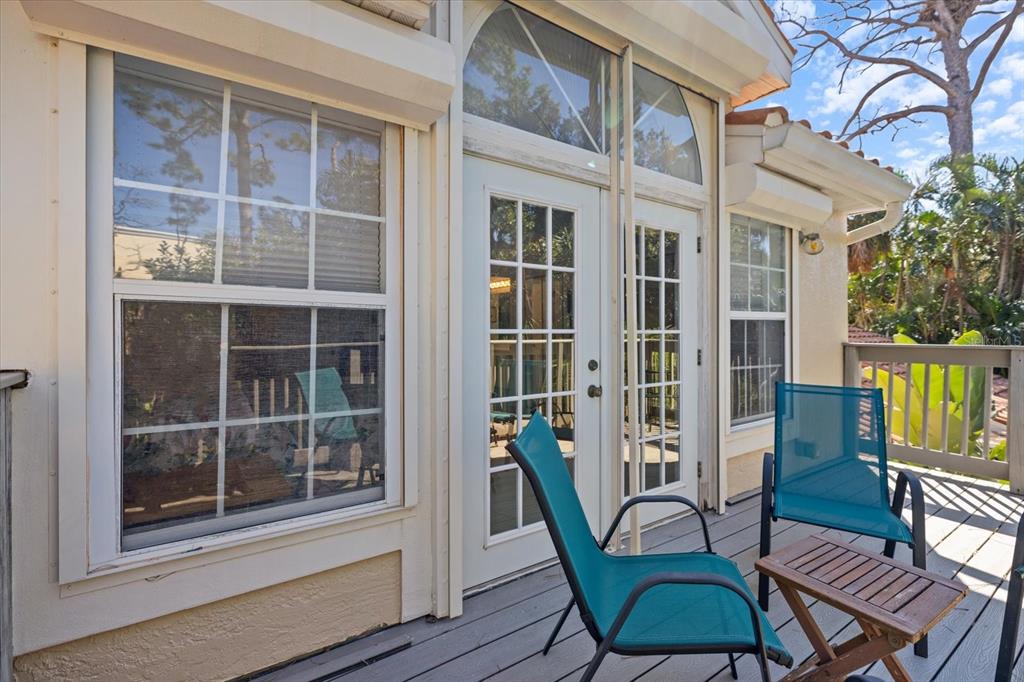 447 Oak Point Road Osprey, FL 34229 - Photo 63 of 99 a view of a building with a table and chairs