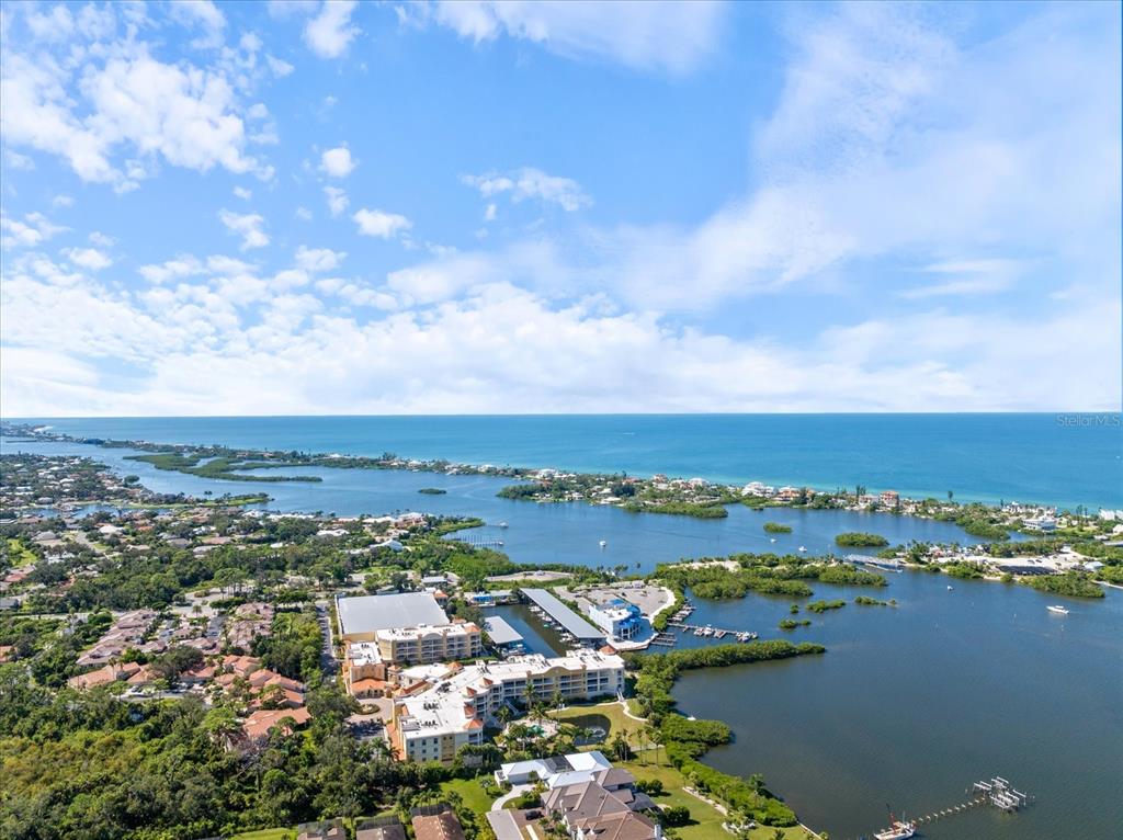 447 Oak Point Road Osprey, FL 34229 - Photo 8 of 99 an aerial view of ocean and residential houses with outdoor space