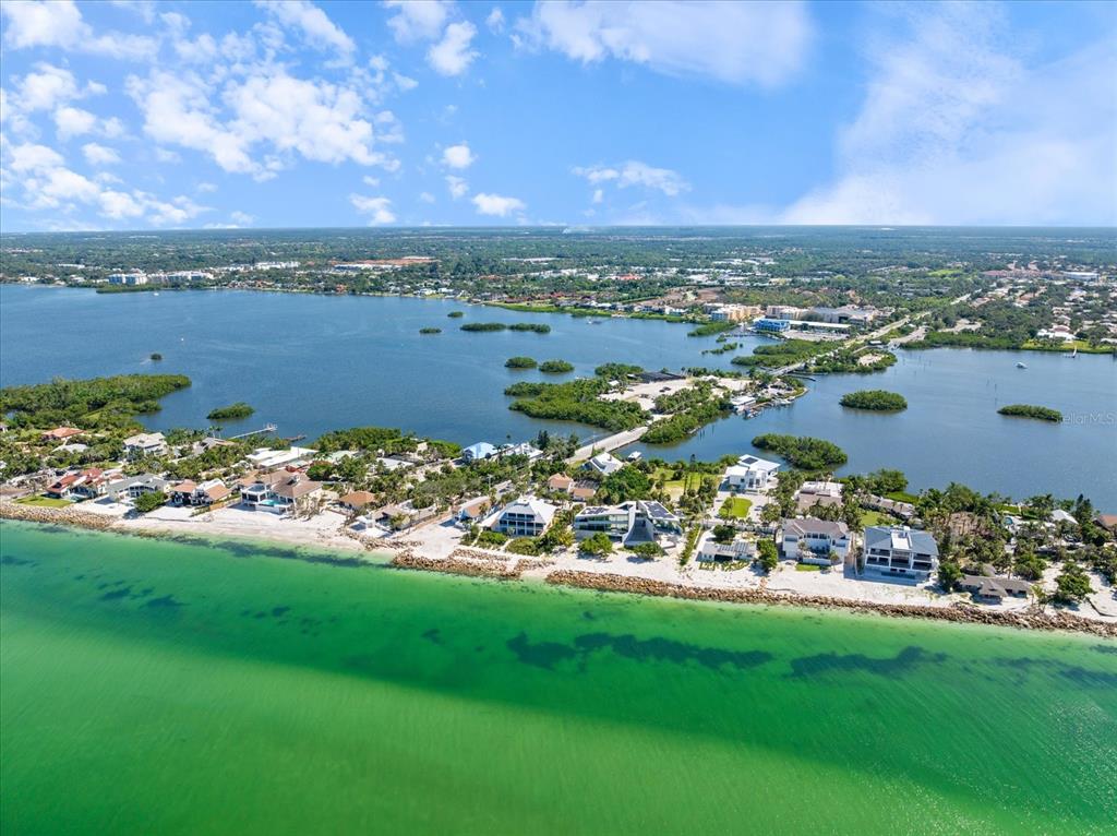 447 Oak Point Road Osprey, FL 34229 - Photo 9 of 99 a view of a city with lots of residential buildings ocean and mountain view in back