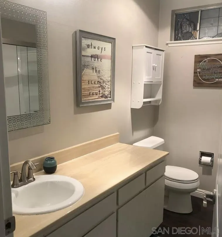 660 San Mario Drive Solana Beach, CA 92075 - Photo 9 of 25 a bathroom with a sink toilet and vanity