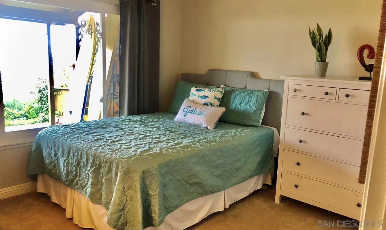660 San Mario Drive Solana Beach, CA 92075 - Photo 10 of 25 a bedroom with a bed and a window