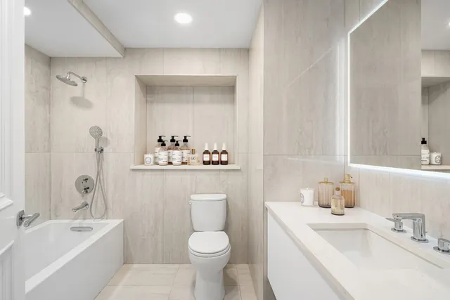 a spacious bedroom with a bed and a window