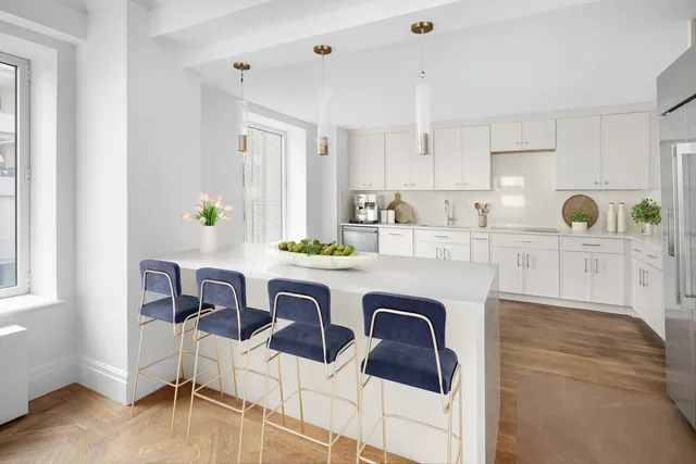 a bathroom with a granite countertop sink mirror and a bath tub