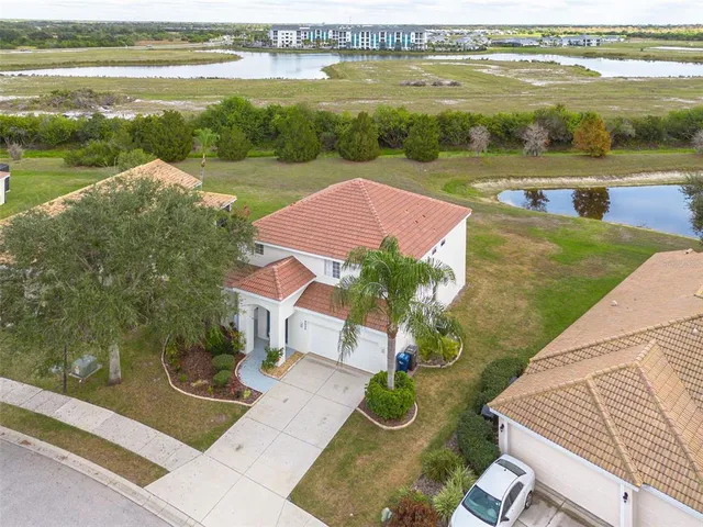 a view of a lake with couches and city view