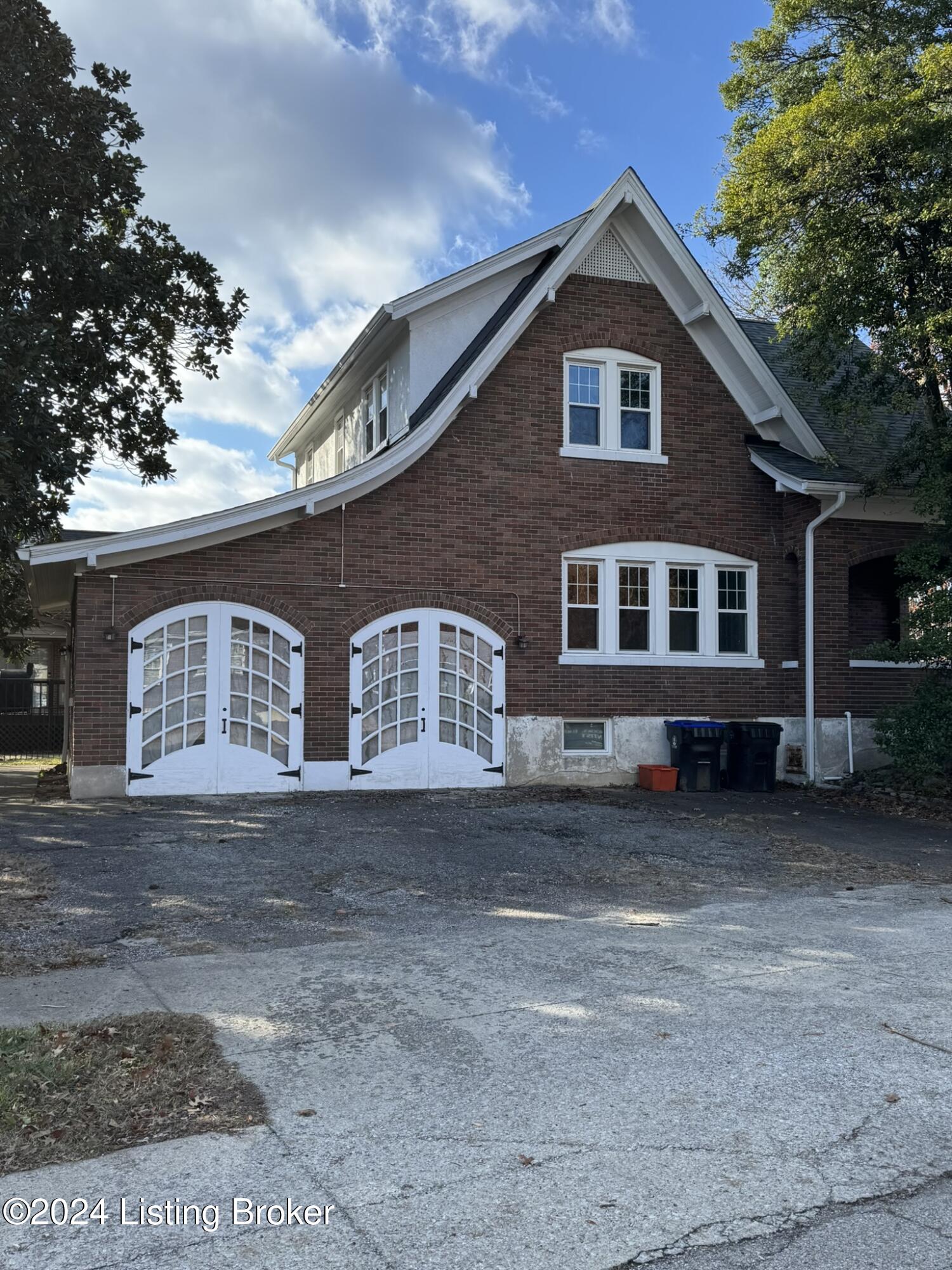3520 Lexington Road Louisville, KY 40207 - Photo 3 of 22 House Side with Garage Doors and Drive