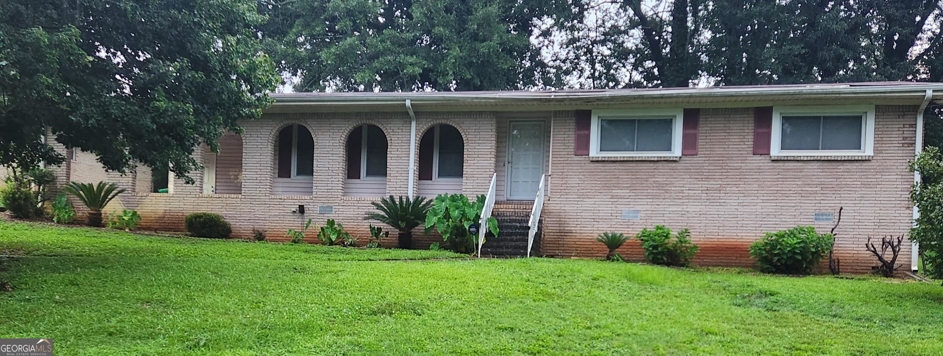 4702 Riverwood Circle Decatur, GA 30035 - Photo 1 of 1 a front view of a house with garden