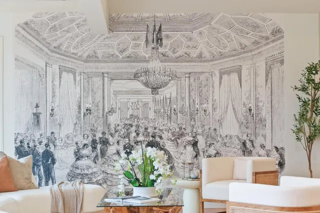 a dining room with furniture a large window and wooden floor