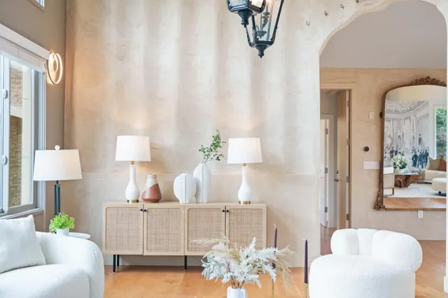 a bedroom with a bed and a chair