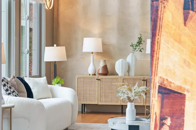 a living room with furniture and wooden floor