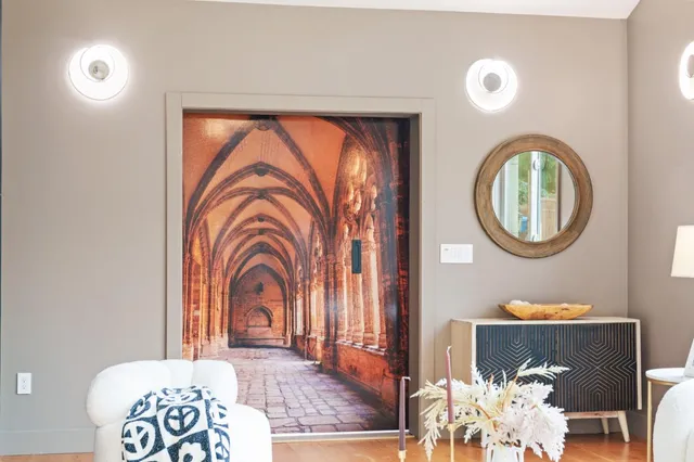 a kitchen with stainless steel appliances granite countertop a refrigerator a sink dishwasher and wooden cabinets with wooden floor