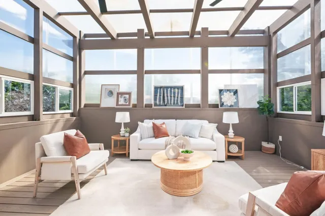 a kitchen with stainless steel appliances granite countertop wooden cabinets a stove a sink and a hard wood floors