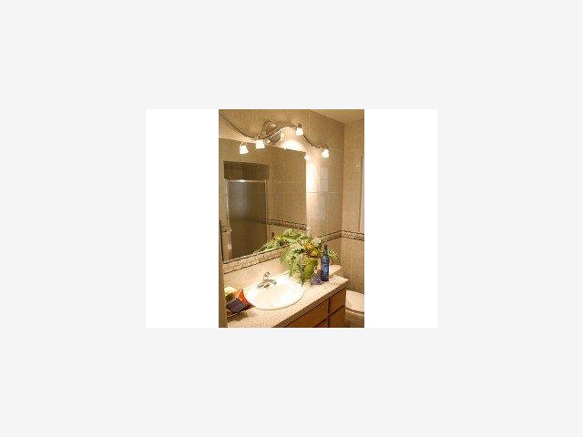 940 Springer Road Los Altos, CA 94024 - Photo 6 of 7 a bathroom with a sink and a mirror