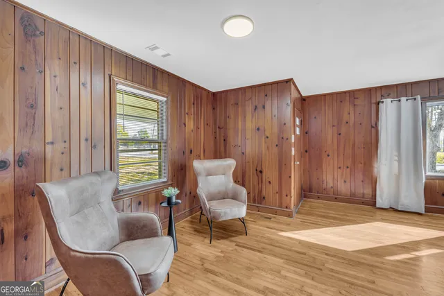 a living room with furniture and a window