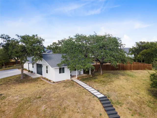 a house with trees in the background