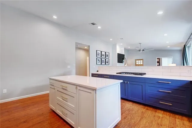 a kitchen with a stove and a sink