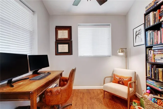 a workspace with furniture and book shelf