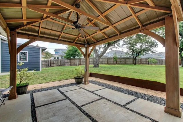 a view of a backyard with sitting area