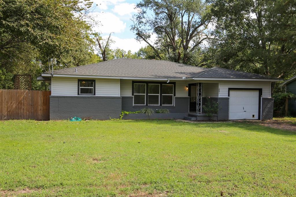 1004 Pecan Street Canton, TX 75103 - Photo 1 of 21 a front view of house with yard and trees in the background