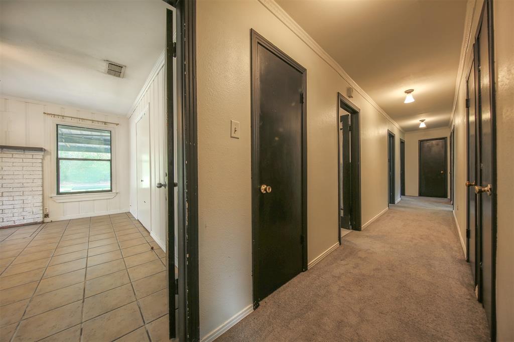 1004 Pecan Street Canton, TX 75103 - Photo 16 of 21 a view of hallway with a bathroom and a sink