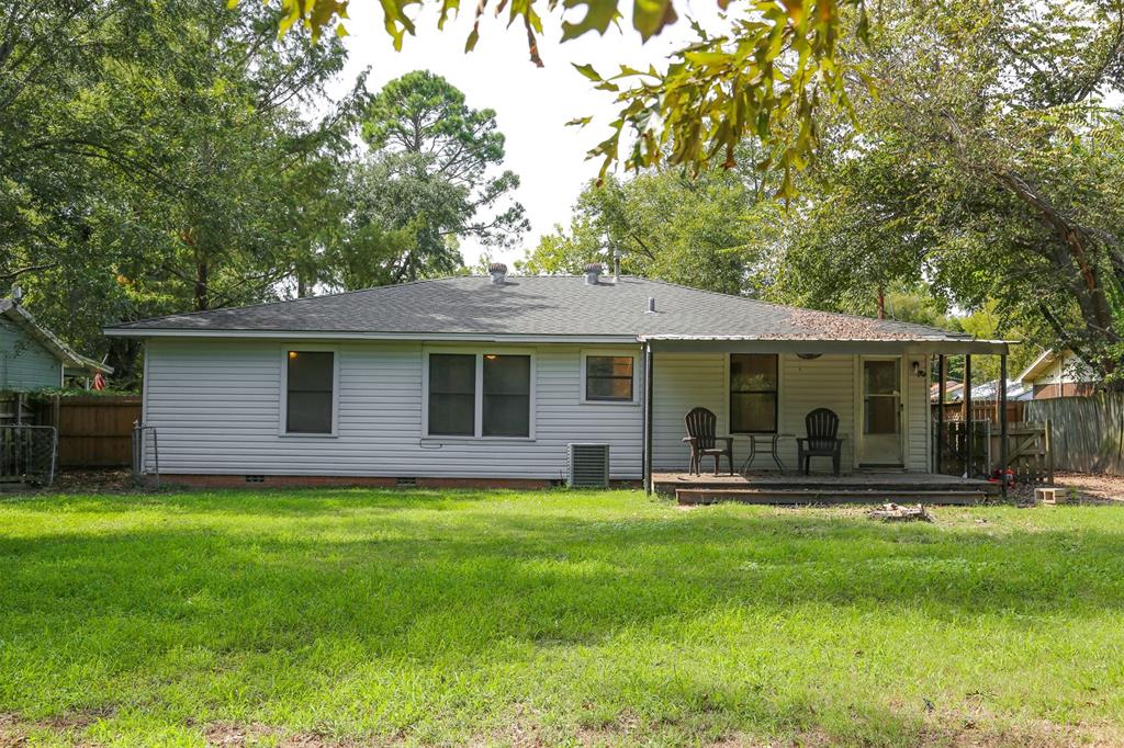 1004 Pecan Street Canton, TX 75103 - Photo 20 of 21 a front view of house with a garden and trees