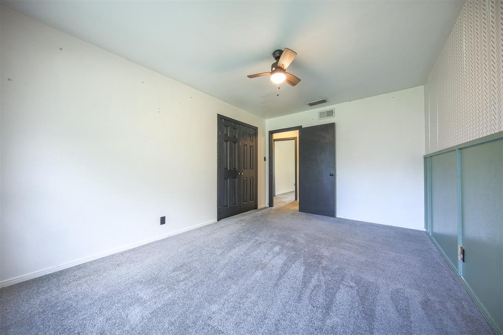 1004 Pecan Street Canton, TX 75103 - Photo 10 of 21 a view of an empty room with a chandelier fan