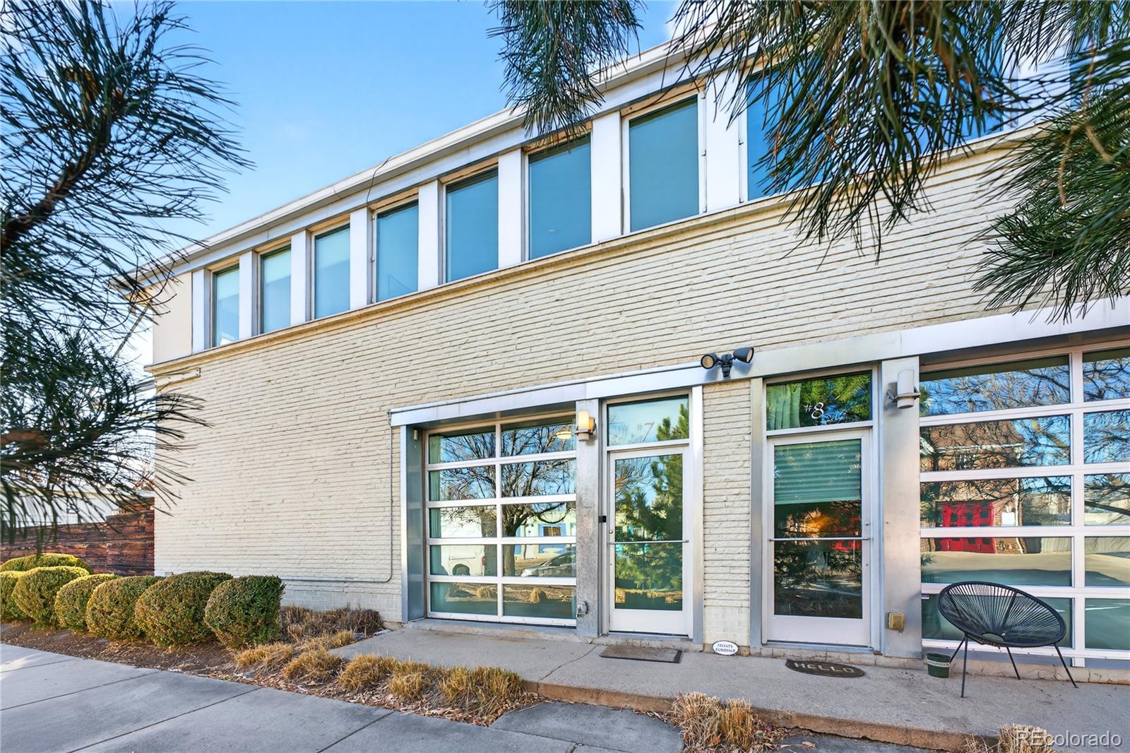 1421 Oneida Street, Unit 7 Denver, CO 80220 - Photo 17 of 22 a front view of a house with a large window